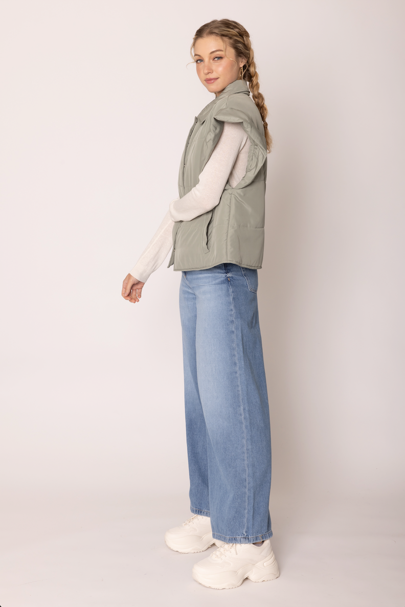The Ruffle Edge Puffer Vest
-Sage
