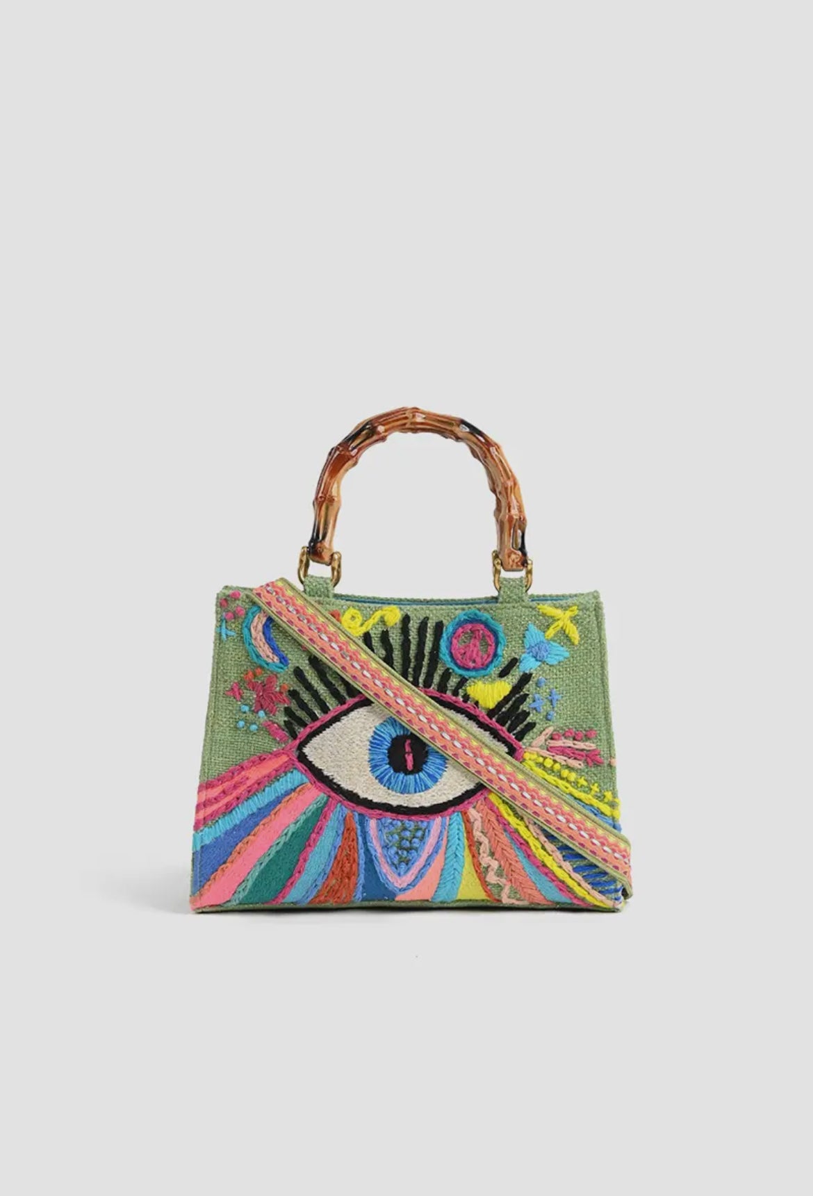 Colorful embroidered eye motif handbag with bamboo handle and crossbody strap