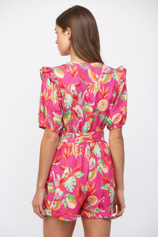 Woman wearing a pink floral dress on a white background