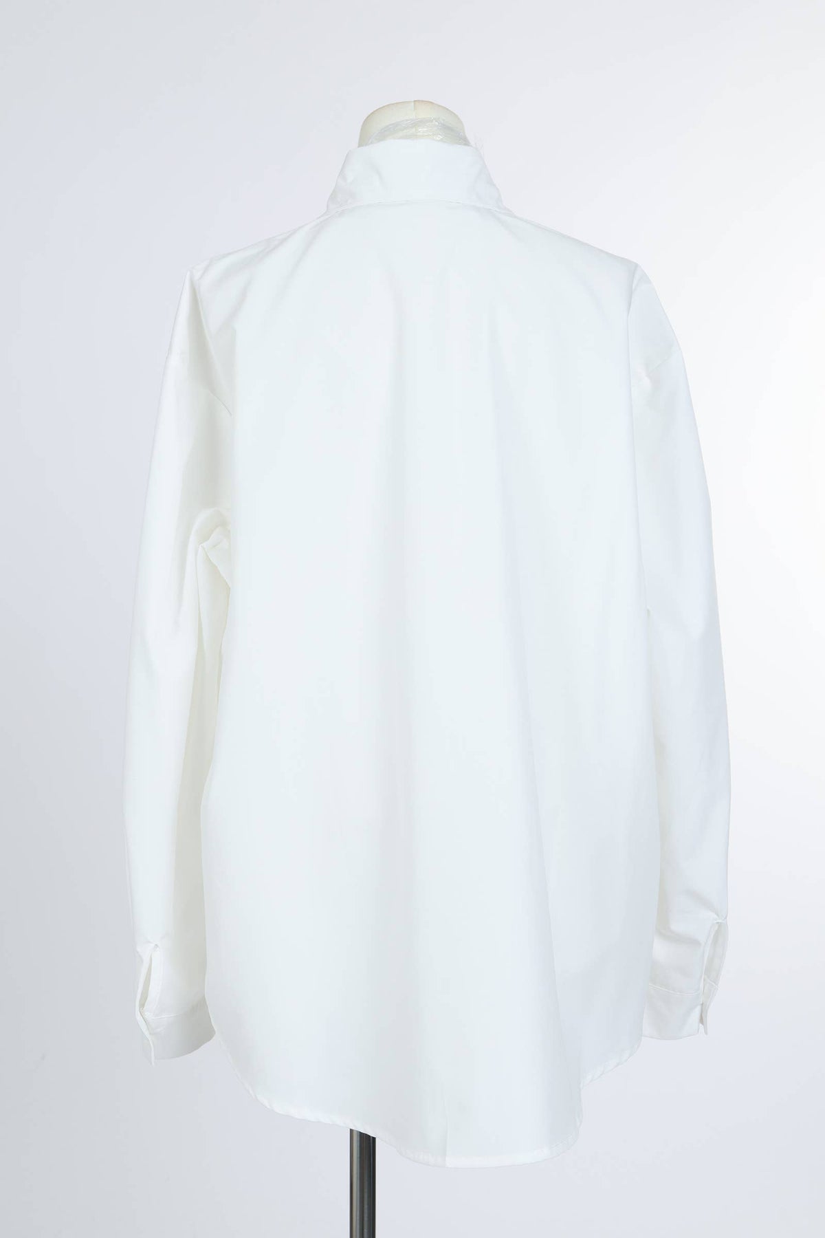 white button-up blouse with emerald jeweled buttons and silver detailing1