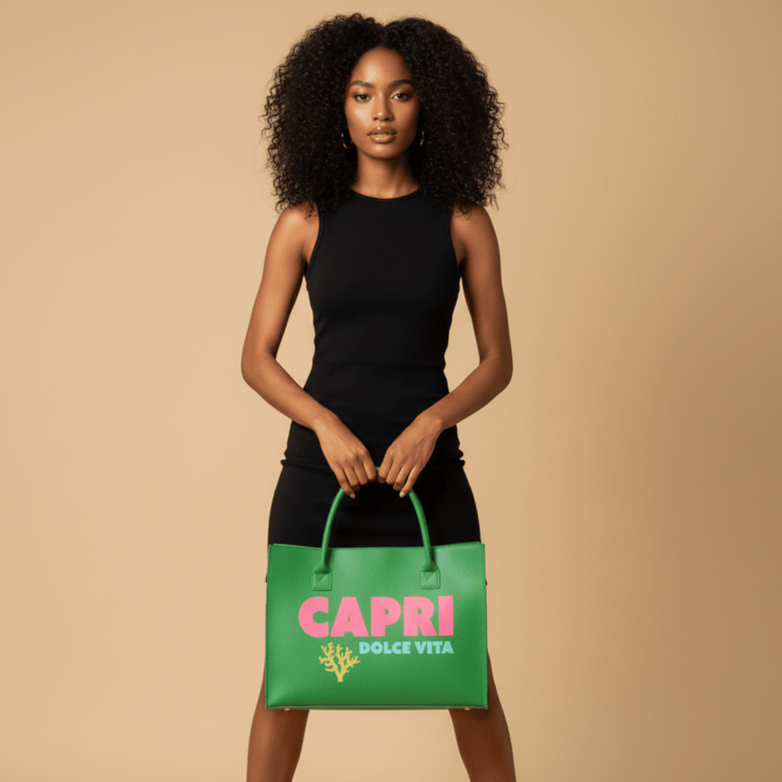 Woman in black sleeveless dress holding green Capri Dolce Vita tote bag, beige background