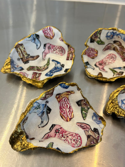 Decorative oyster shell dishes with colorful cowboy boot pattern and gold painted edges
