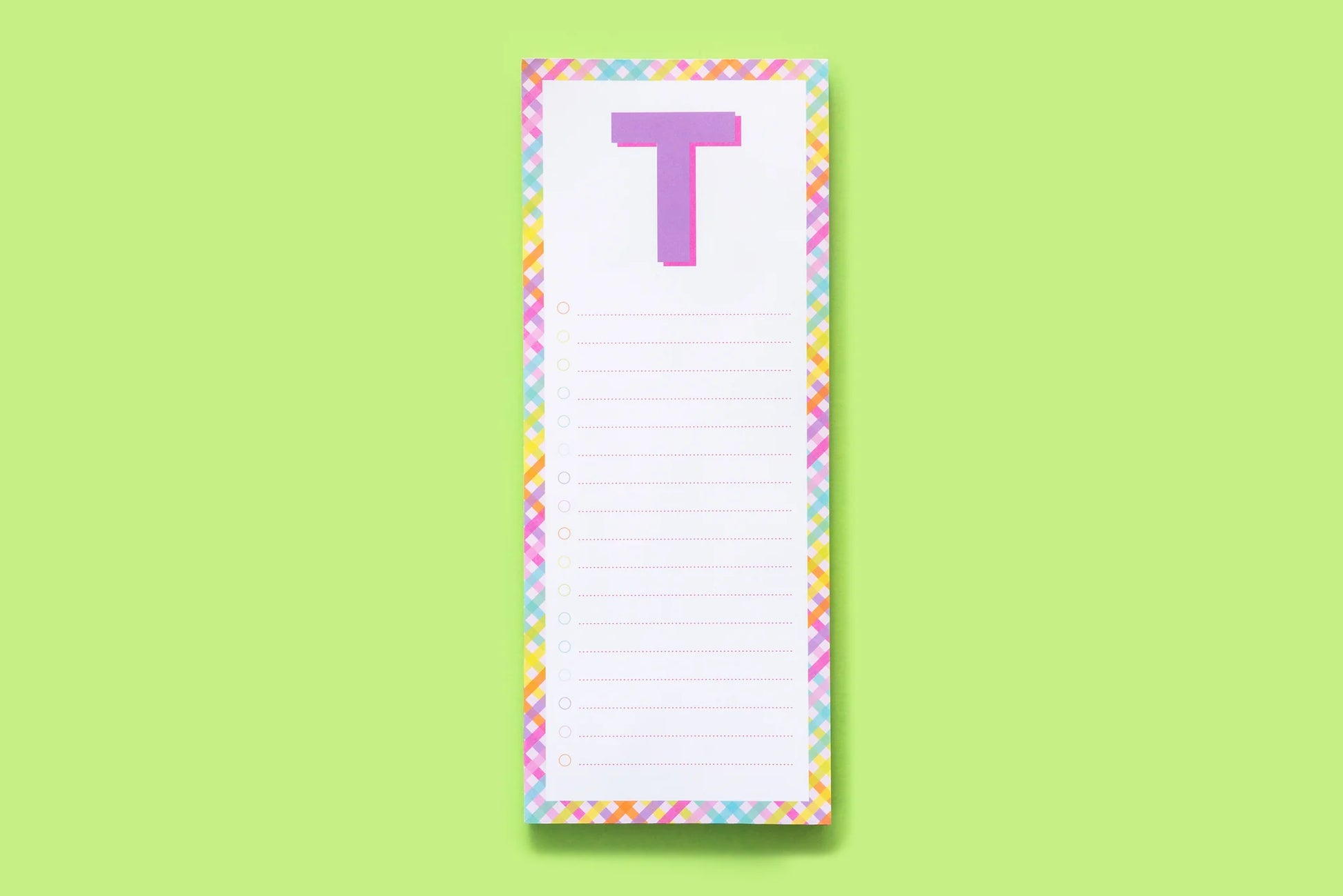 Colorful notepad with letter T, rainbow border, lined list on light green background