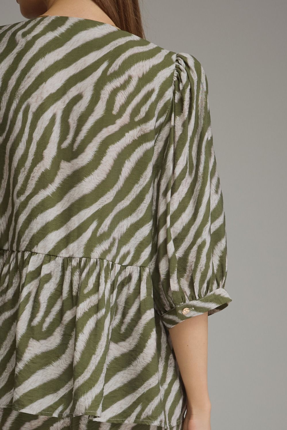 The Sloane Zebra Peplum Top – Olive