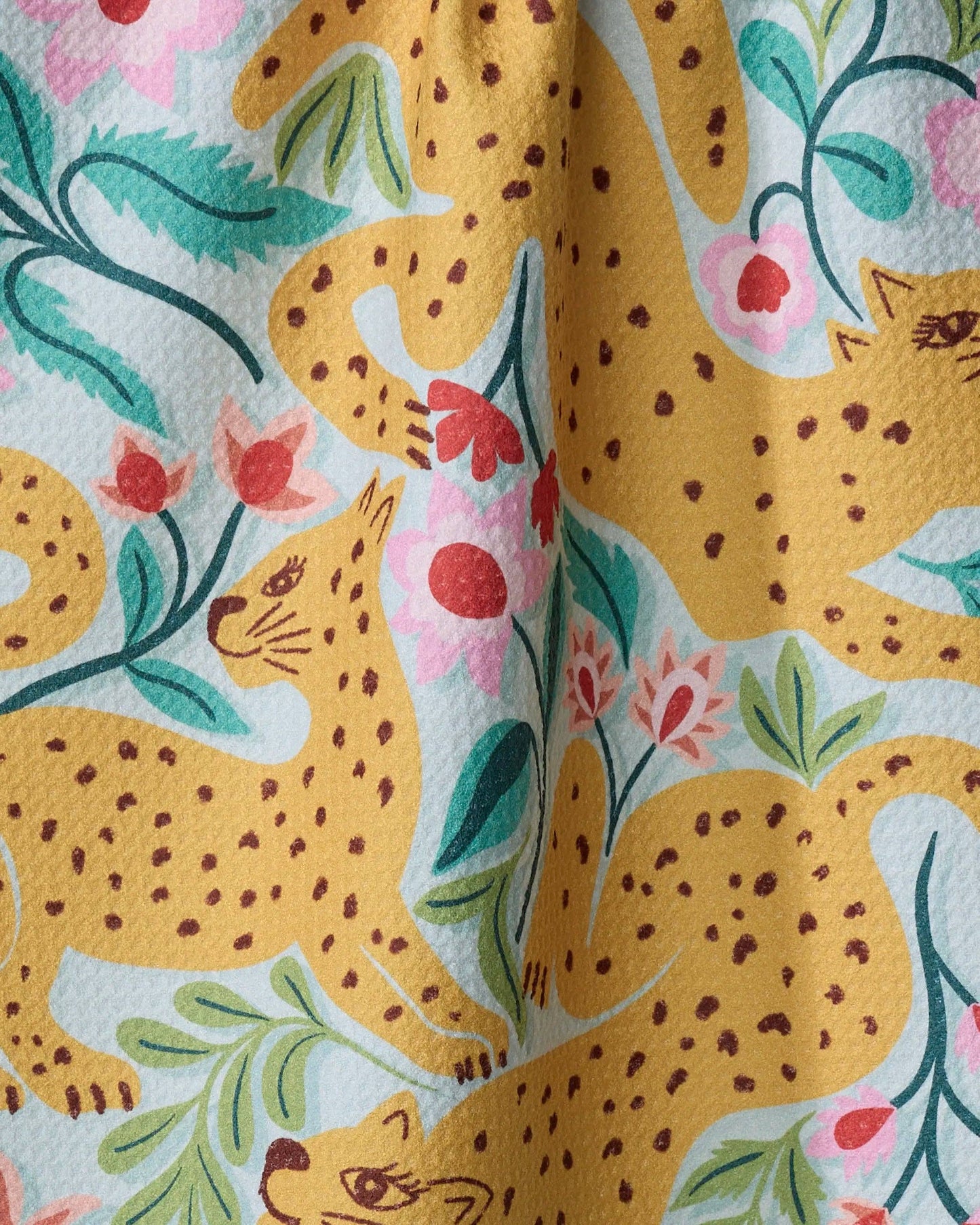 yellow cheetah and floral print fabric pattern with pink and green leaves