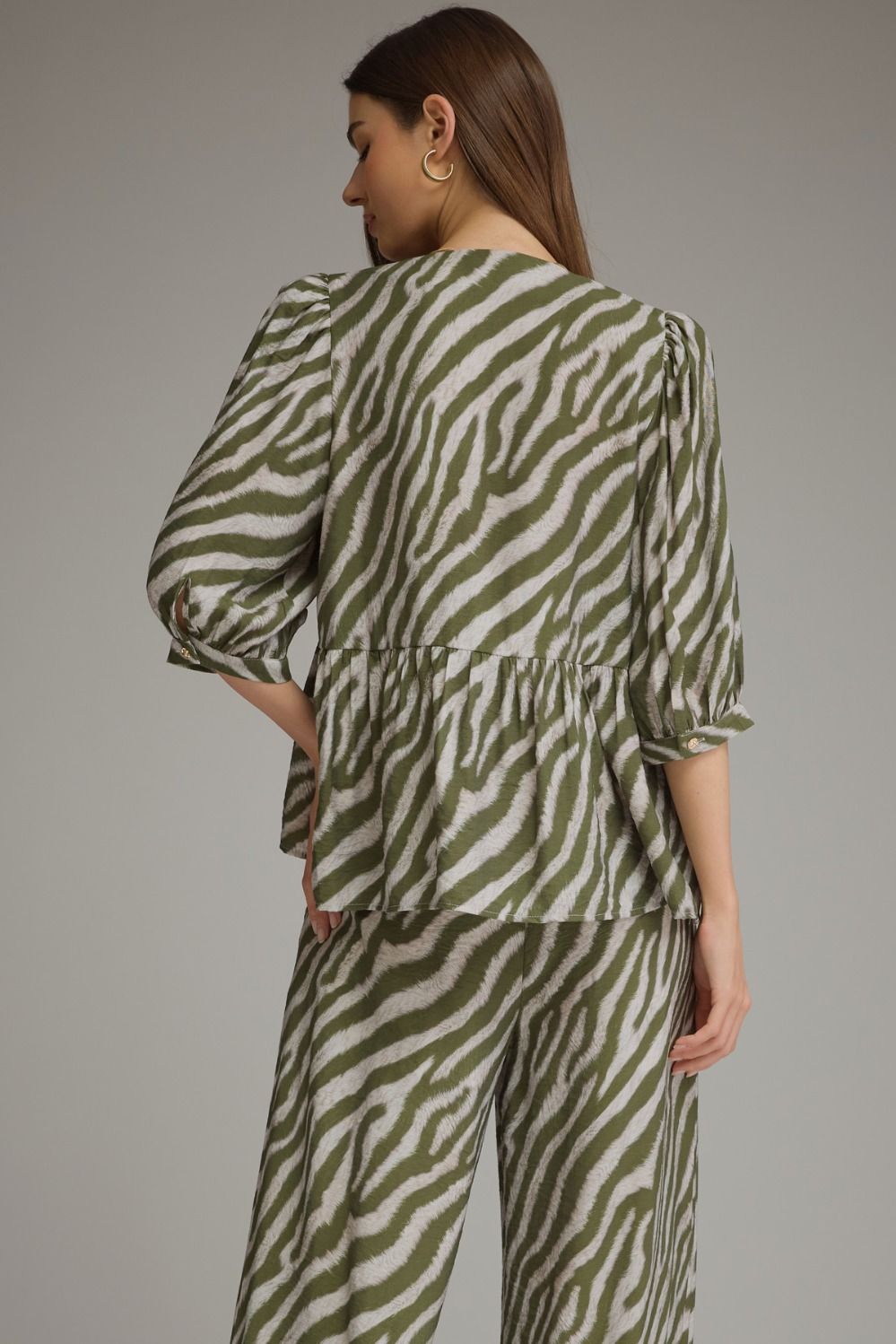 The Sloane Zebra Peplum Top – Olive