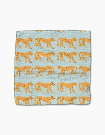 Light blue throw blanket with repeating yellow cheetah print pattern, cozy home accessory.