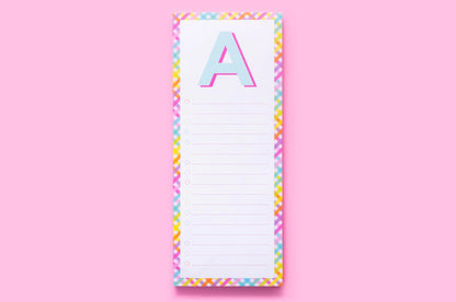 Colorful notepad with letter A, rainbow border, on pink background, stationery gift