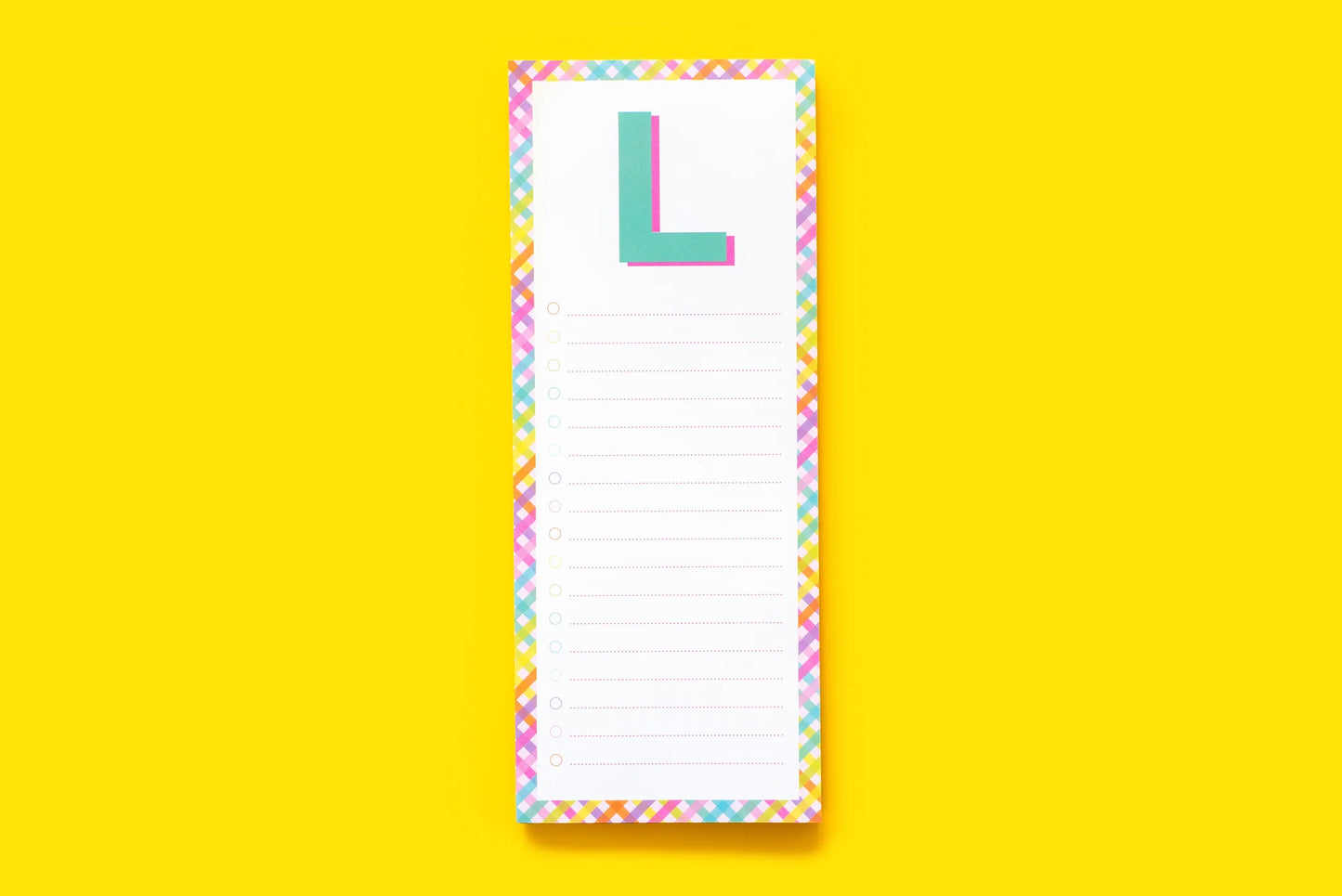 Colorful notepad with 'L' monogram and checklist design on bright yellow background