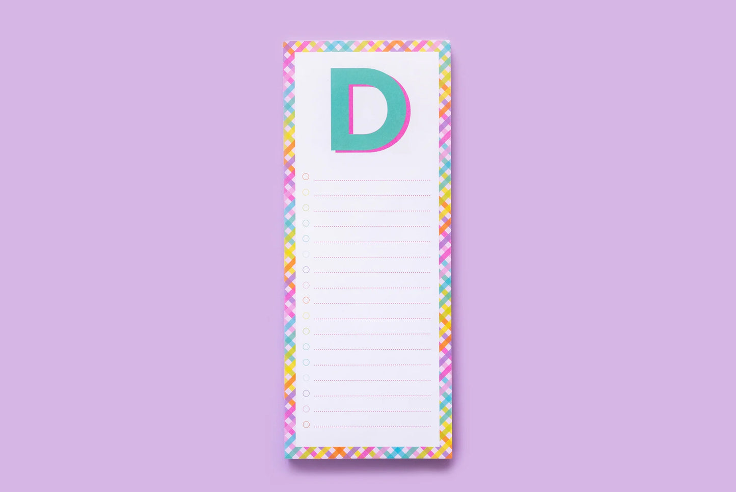 Colorful letter D notepad with rainbow border on purple background