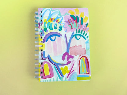 Colorful abstract notebook on a yellow background
