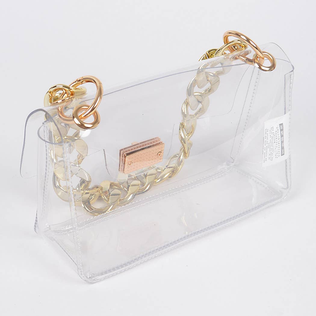 Gold chain bracelet on a clear stand with a visible brand logo.