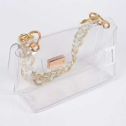 Gold chain bracelet on a clear stand with a visible brand logo.