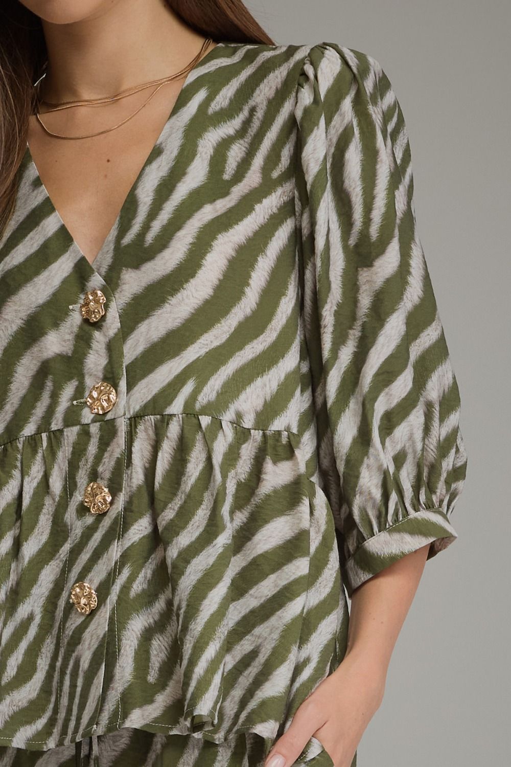 The Sloane Zebra Peplum Top – Olive