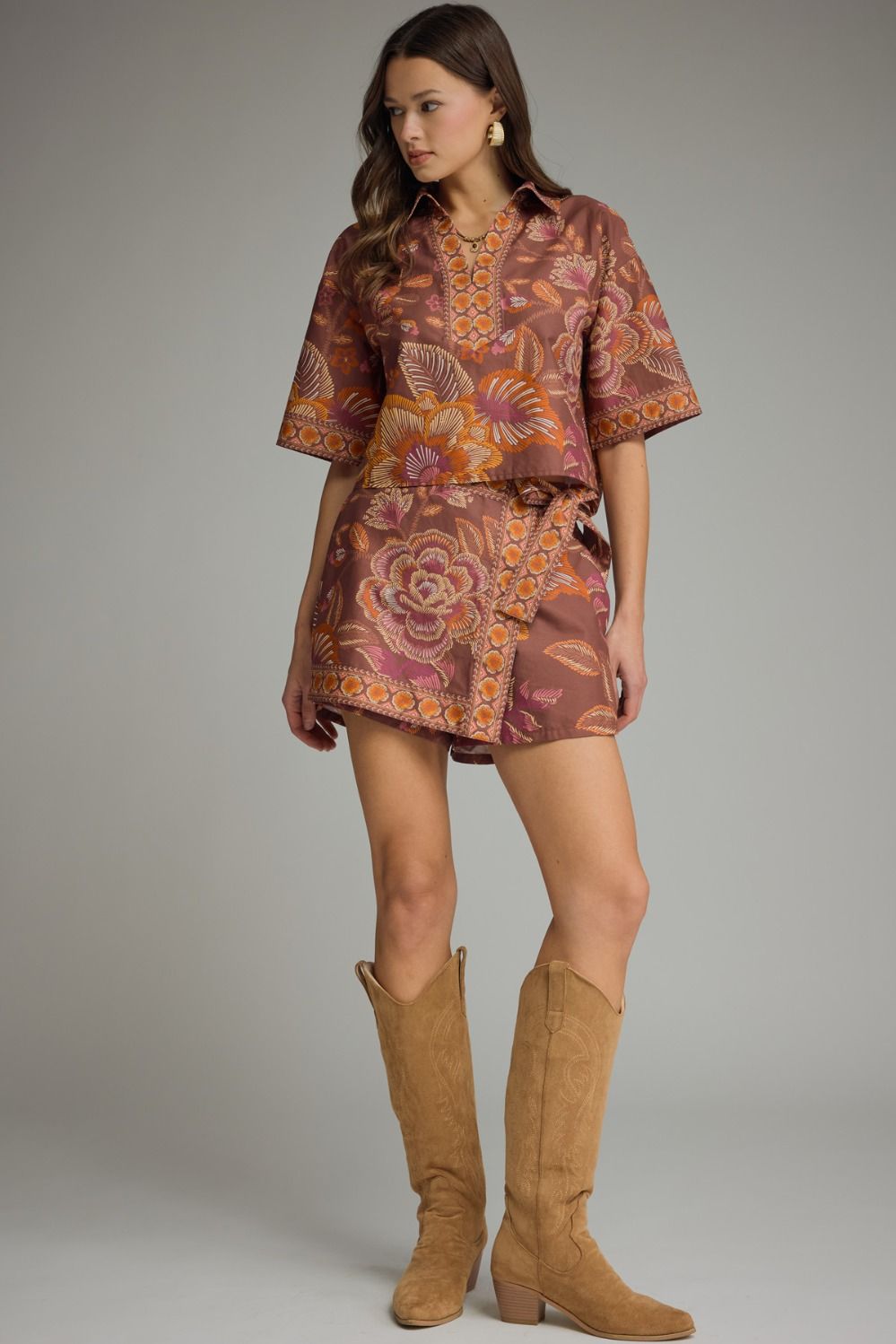 Terracotta floral two piece skort set styled with tan western boots for a fall boutique outfit.