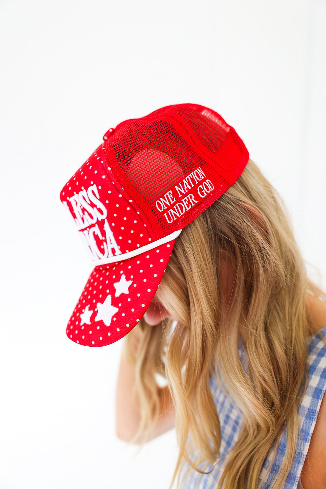 Red cap with 'One Nation Under God' text and star patterns on a white background