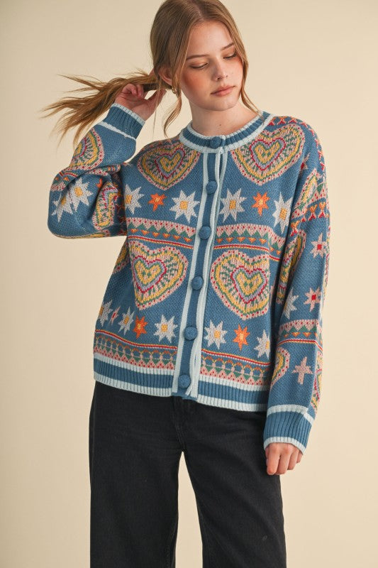 Woman wearing a colorful patterned sweater against a beige background