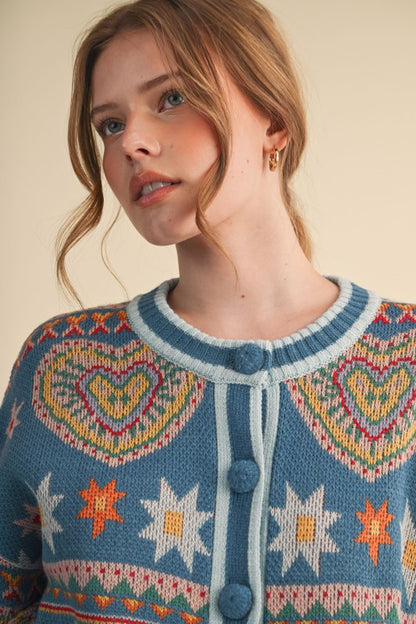 Woman wearing a patterned sweater with hearts and stars on a beige background