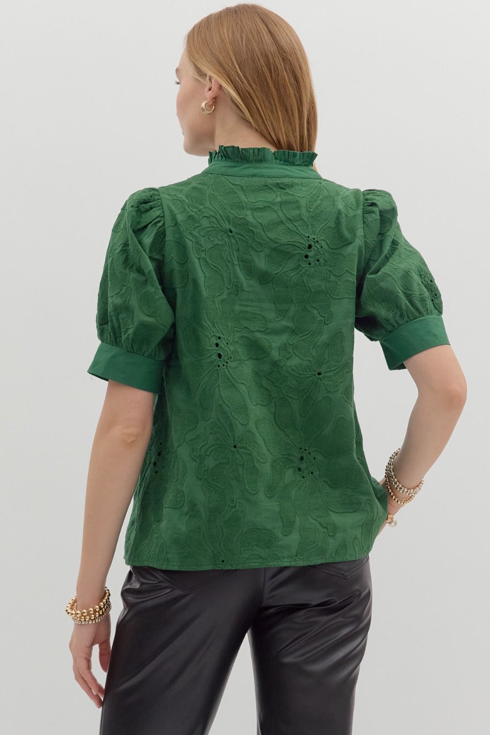 Back view of the Emerald Bloom Eyelet Top showing green floral eyelet embroidery, puff sleeves with cuffs, and ruffled collar detail – Milo & Lily Boutique.