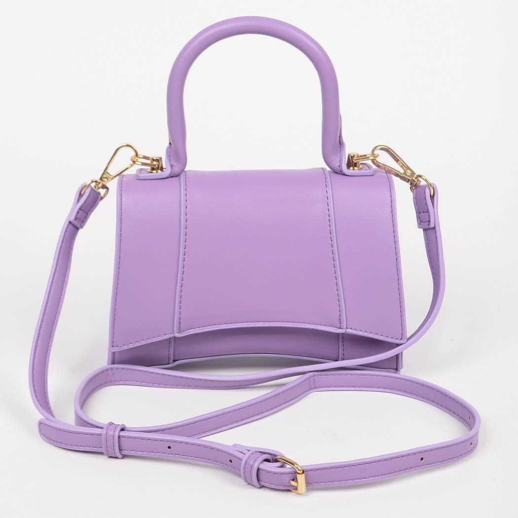A lavender purple faux leather handbag with a top handle, a detachable shoulder strap, and gold-tone hardware, shown on a plain white background.