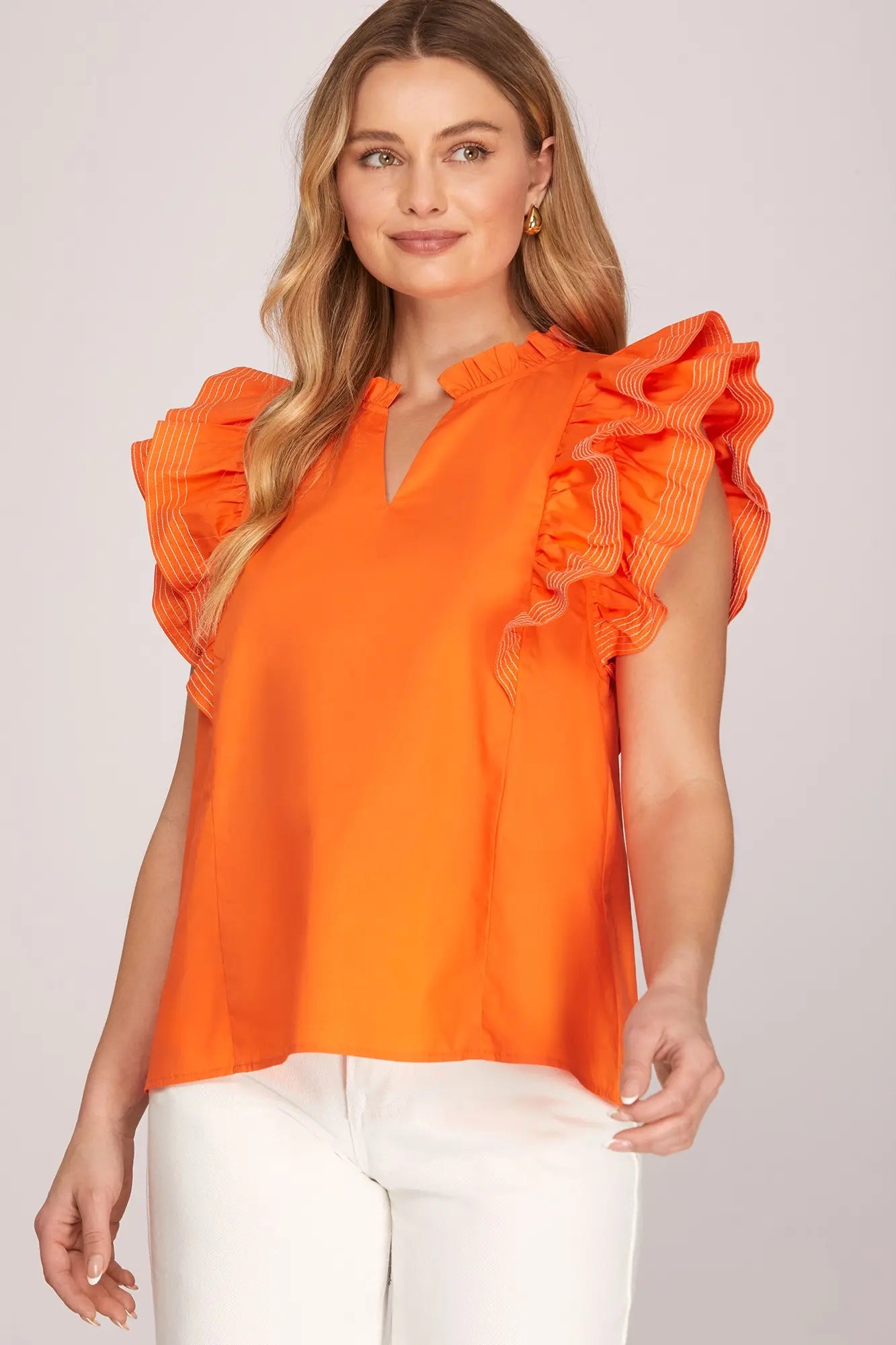  Women’s bright orange ruffle sleeve top for Oklahoma State football game day and Stillwater tailgates