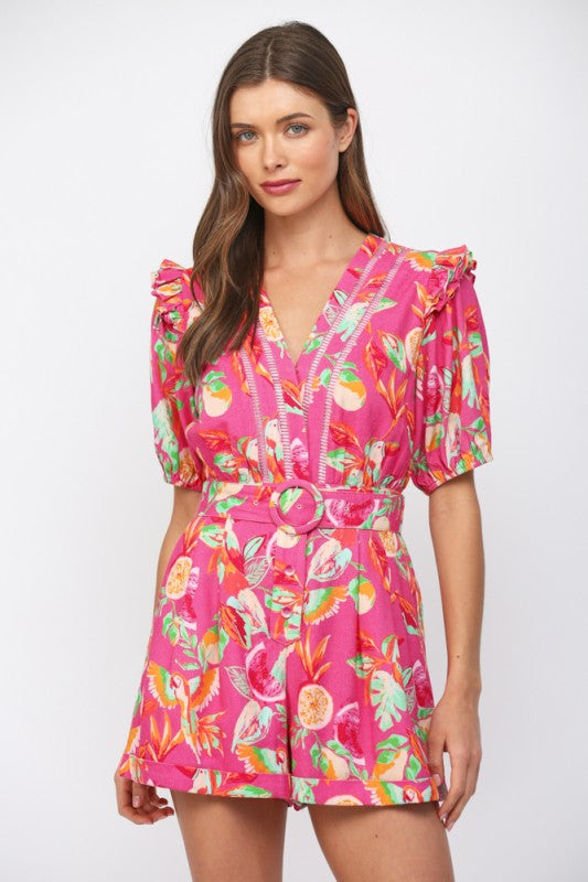 Woman wearing a pink floral dress on a white background