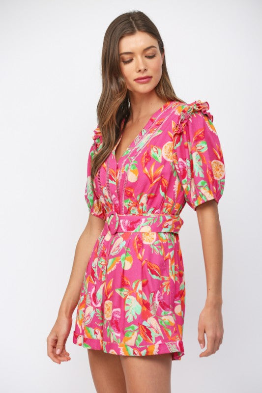 Woman wearing a pink floral dress on a white background