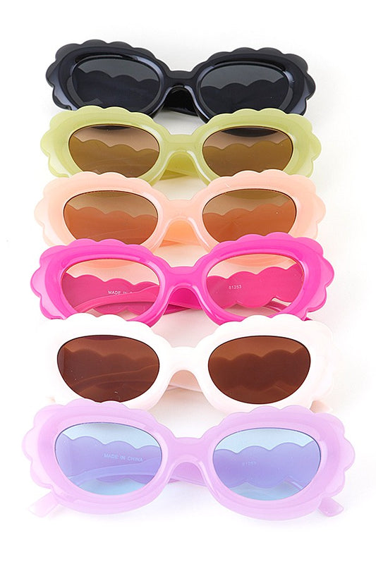 Stack of scallop-edged sunglasses in various pastel colors, women's fashion accessory