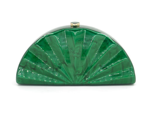Green clutch bag with sunburst design on a white background