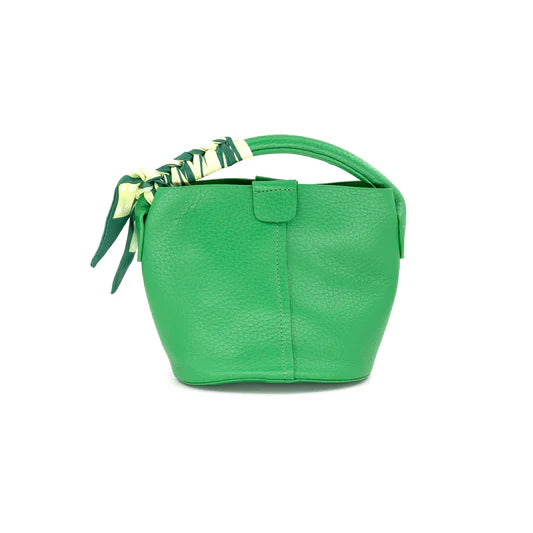 Green handbag with a decorative ribbon on a white background