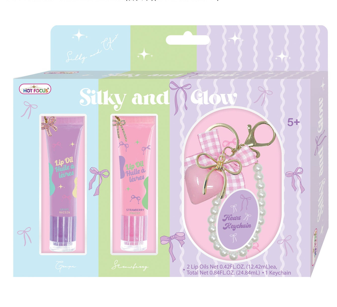 Hot Topic 'Silky and Glow' nail care gift set in its original packaging, featuring a purple lip oil tube, a pink nail polish tube, and a decorative gift box with a pearl necklace charm, shown against a white background with dimensions text at the top.