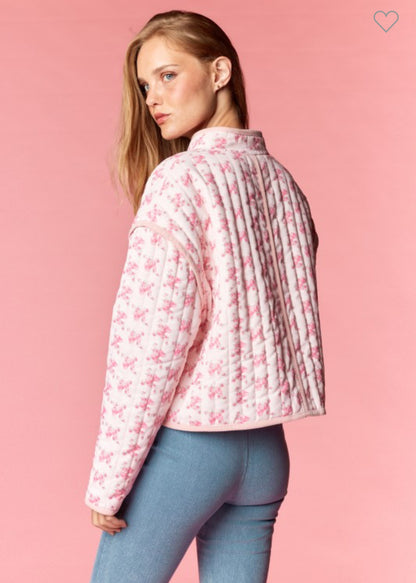 Back view of light pink floral quilted jacket with vintage charm and cozy feminine style — Milo & Lily Boutique.