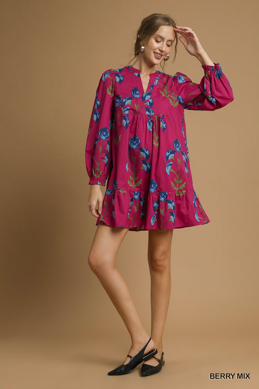 Model wearing a berry pink floral babydoll dress with long sleeves and ruffle hem — bold boutique-style fall dress from Milo & Lily Boutique.