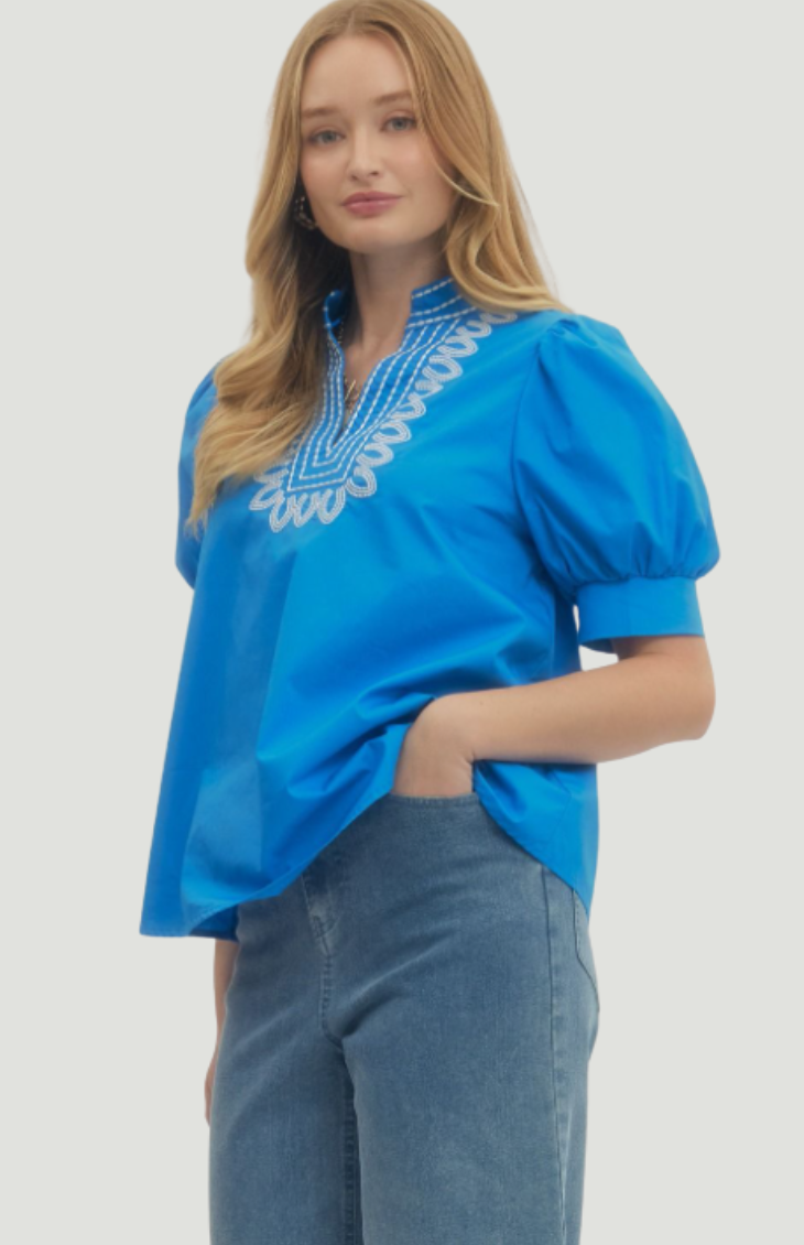 Cobalt blue puff sleeve blouse with embroidered neckline, lightweight women’s summer top paired with jeans