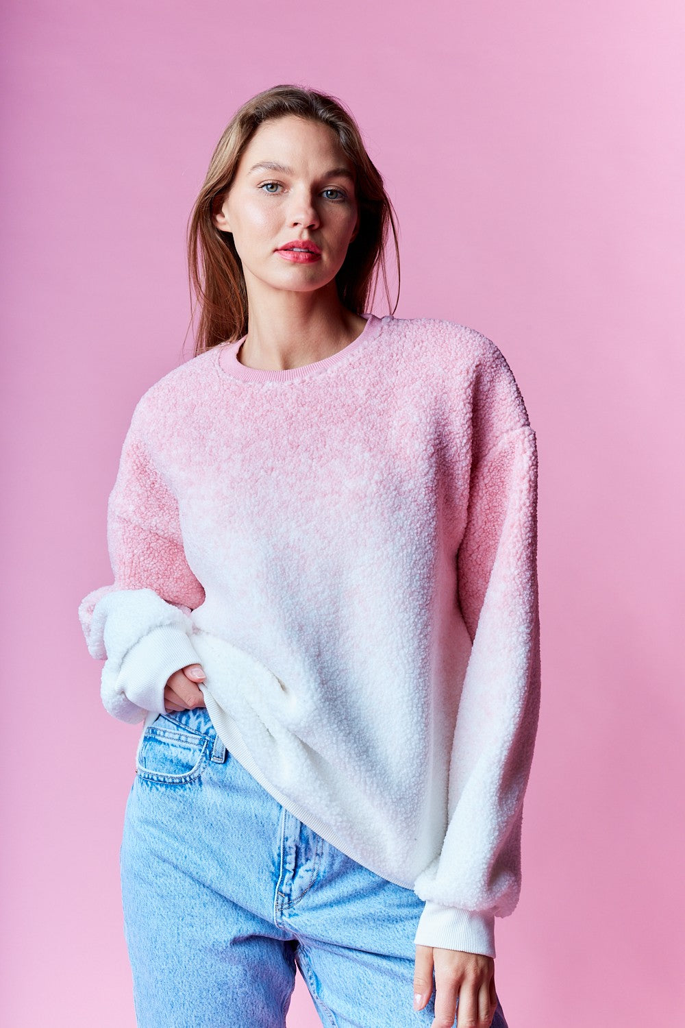 Cozy cotton candy ombre fleece pullover styled with light wash jeans