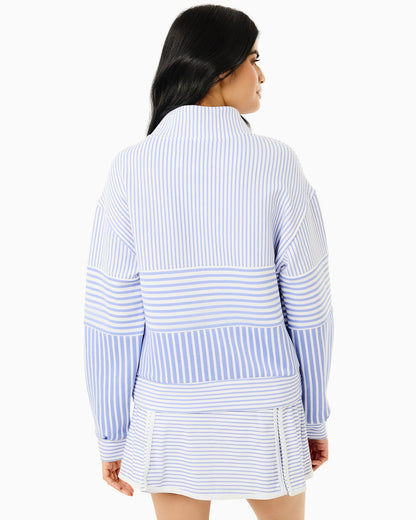 Woman wearing a blue and white striped outfit on a white background