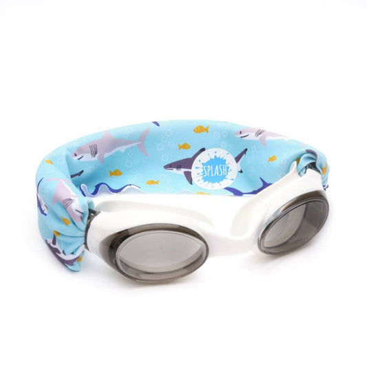 Children's swim goggles with blue shark print and yellow fish, gray lenses, and Splash logo.