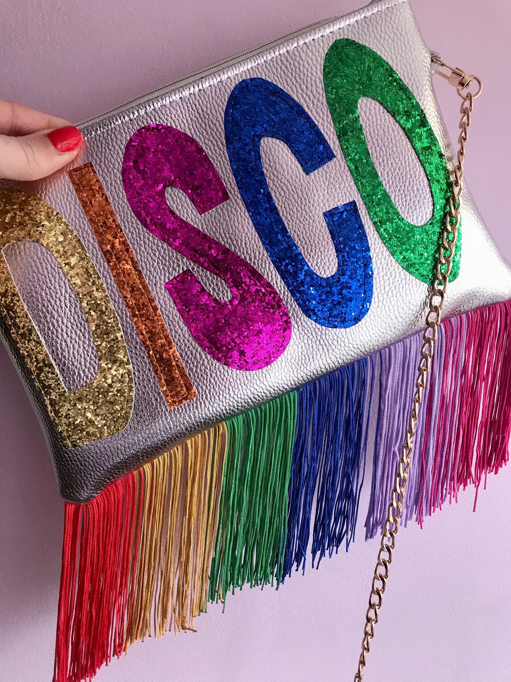 Silver clutch bag with glitter “DISCO” letters and rainbow fringe detail from Milo & Lily Boutique