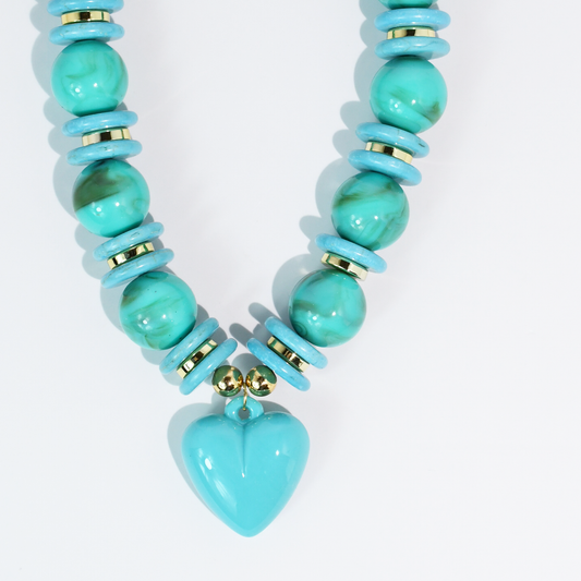 Turquoise beaded necklace with gold accents and a heart-shaped pendant, women's jewelry