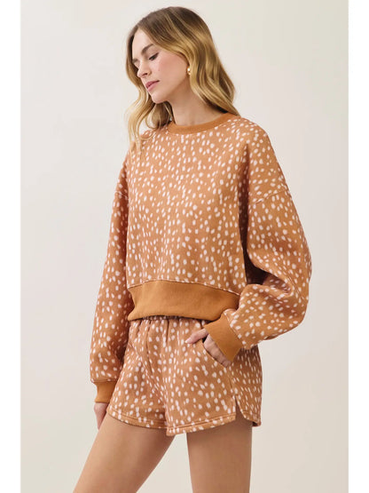 Tan fawn spotted sweatshirt side view styled with matching shorts