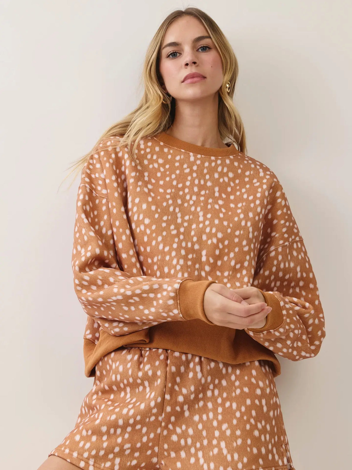 Camel tan ivory fawn spotted sweatshirt on model front view