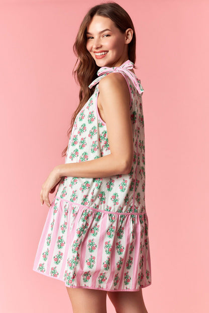Pink floral tie shoulder mini dress with drop waist hem and pastel stripe detail