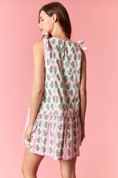Feminine pink floral summer dress with adjustable bow tie straps