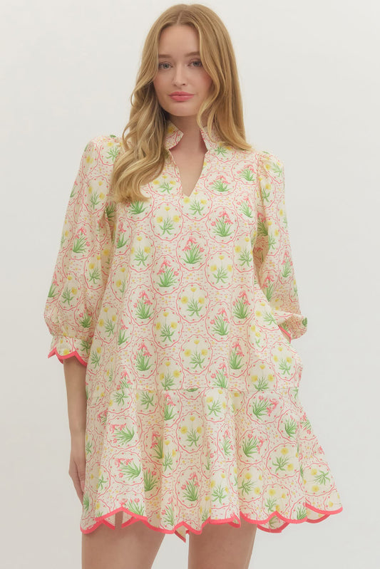 Woman wearing a floral dress with a light background