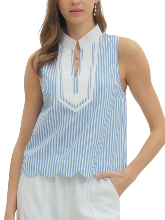 Woman wearing a blue and white striped sleeveless top with a white collar.