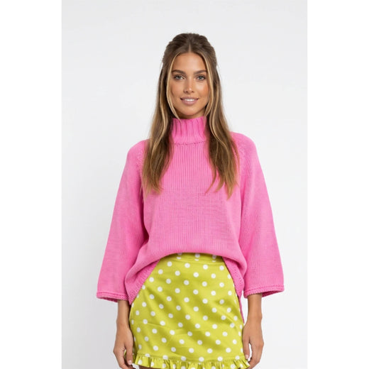 Front view of hibiscus pink mock-neck sweater with wide three-quarter batwing sleeves.