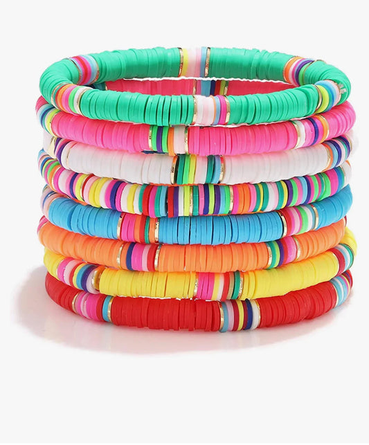 Stack of colorful heishi disc bead stretch bracelets for women on a white background