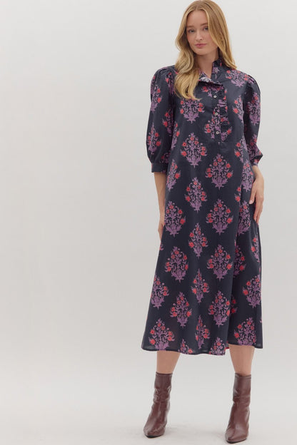 Front view of navy floral midi dress with puff sleeves and ruffle collar