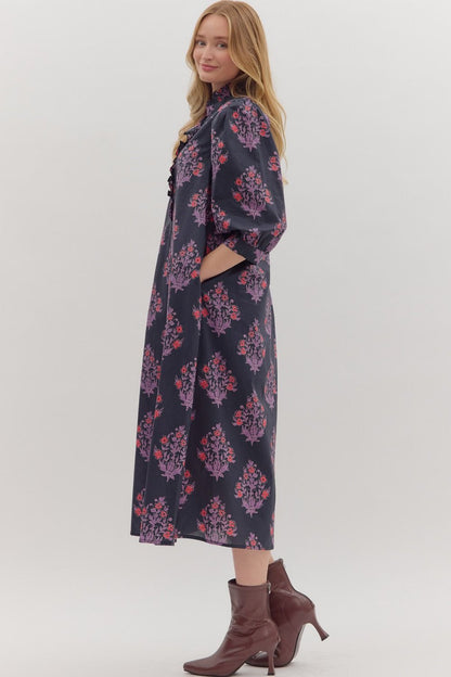 Side view of navy and lilac floral dress with button front detail