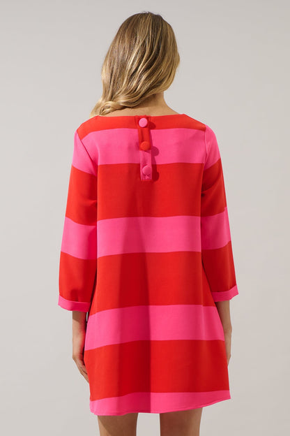 Back view of red and pink striped shift dress with button detail